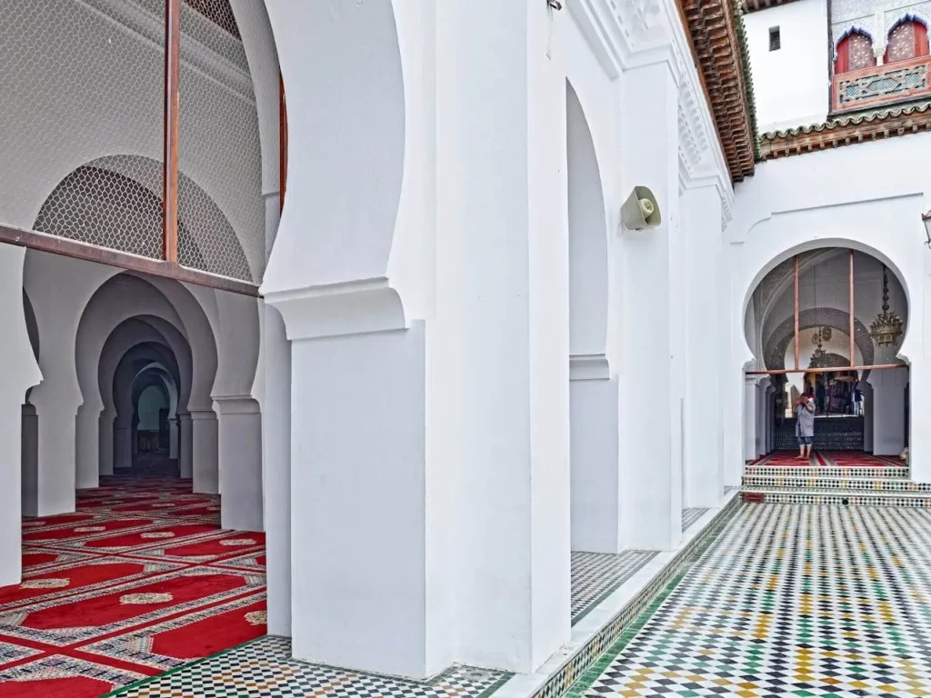 


<p></noscript>Al Quaraouiyine University’s legacy of learning is rooted in its commitment to academic excellence. As <strong>George Makdisi, a renowned historian, noted</strong>, “Al Quaraouiyine is not just a university; it’s a symbol of the Islamic world’s contribution to the global heritage of knowledge.” The university has been a center of intellectual inquiry, fostering a culture of scholarship that spans centuries.</p>



<p>The university’s impact on <strong>Islamic studies</strong> cannot be overstated. It has been a hub for the study of various disciplines, including theology, jurisprudence, and philosophy. Scholars such as <em>Ibn Rushd (Averroes)</em> have contributed significantly to the development of philosophical thought, influencing both the Islamic world and Europe.</p>



<h3 class=